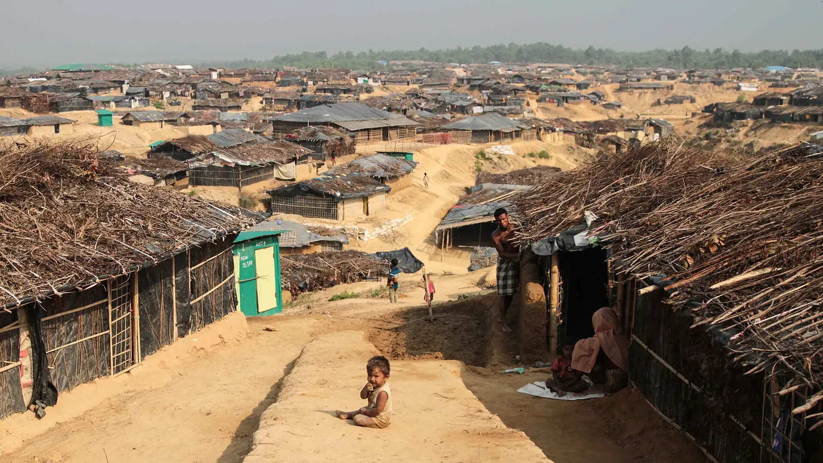 Rows of bamboo and tarpaulin shelters stretching across hills in Kutupalong camp